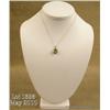 Image 1 : Elegant 10 karat two-tone gold ladies pendant set  with a center green Peridot weighing over 1.50  c