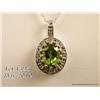 Image 2 : Elegant 10 karat two-tone gold ladies pendant set  with a center green Peridot weighing over 1.50  c