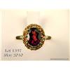 Image 2 : Marvelous 10 karat yellow gold ladies ring set  with a center oval garnet weighing approx. 2.00  car