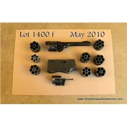 Small lot of Webley revolver cylinders, a barrel  assembly and cylinder, an Enfield rifle receiver  