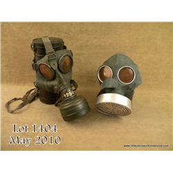 Lot of two German WWII era gas masks, one  military, one civilian or air defense. Both with  cannist
