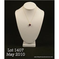 Elegant 10 karat rose gold ladies pendant set with  a center fine intense purple Amethyst weighing  