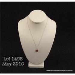 Attractive 10 karat white gold ladies pendant set  with a center red created ruby weighing over 2.50