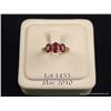 Image 1 : Stylish 10 karat yellow gold ladies ring set with  three red rubies weighing over 2.00 carats and 8 
