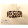 Stylish 10 karat yellow gold ladies ring set with  Amethysts and diamonds weighing approx. 1.00  car