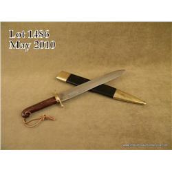 Reproduction of an Ames Rifleman’s knife and  leather sheath, approx. 22” with a 16” blade in  overa