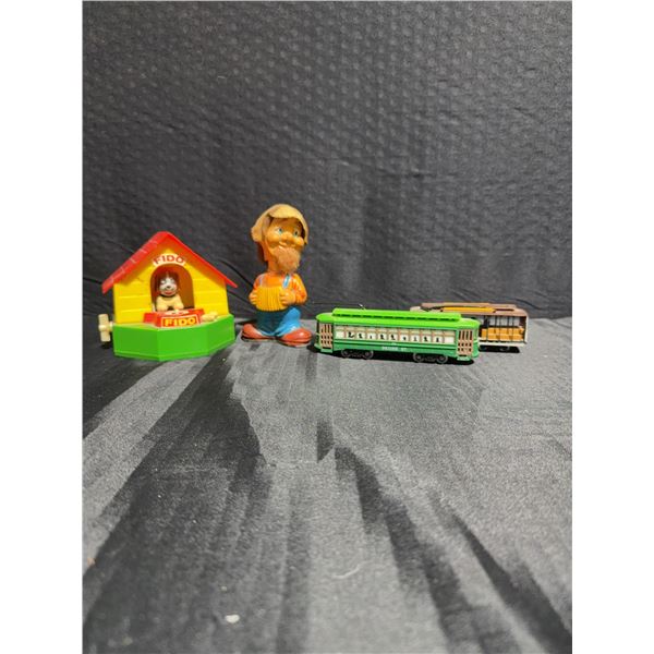 4 Plastic Toys: Fido Bank, Figure, Desire St. Trolley, Powell & Mason Cable Car