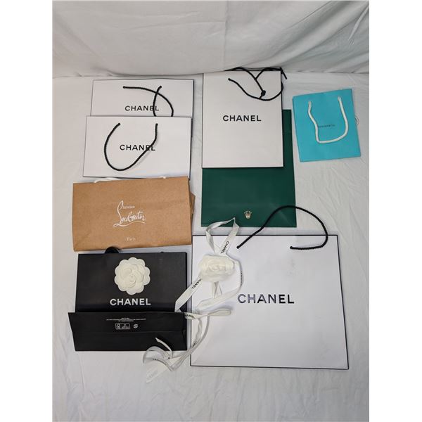 Lot of designer name brand shopping bags