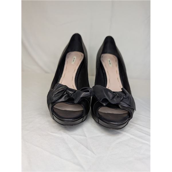 Miu Miu Black leather heels with bow detail