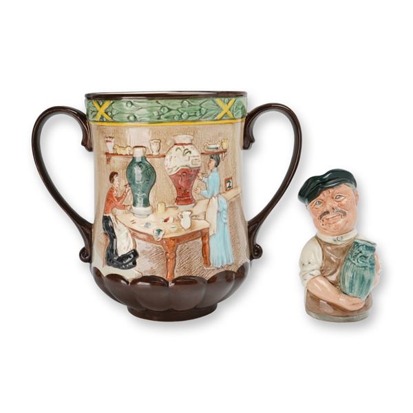 2pc Royal Doulton Pottery In The Past Loving Cup (D6696) and Albert Sagger The Potter (D6745) Doulto