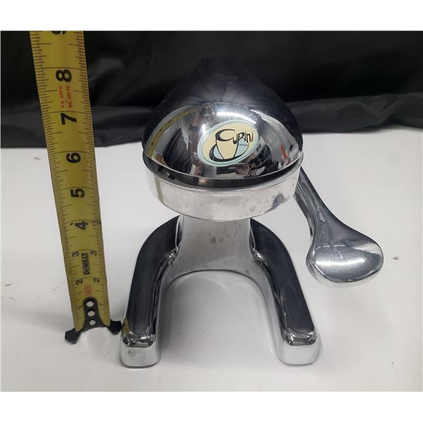 Cupini Design manual lever-style citrus juicer.