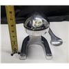 Image 1 : Cupini Design manual lever-style citrus juicer.