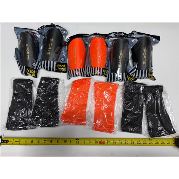 Set of six pairs soccer/football protective shin guards and corresponding matching compression calf 