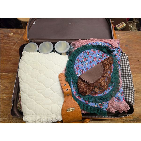 Suitcase with of misc cloth and fabric