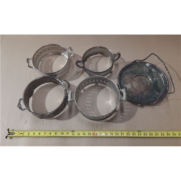 Vintage silver-plated casserole dish holders or trivets, often used to protect tables from hot dishe