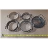 Image 1 : Vintage silver-plated casserole dish holders or trivets, often used to protect tables from hot dishe