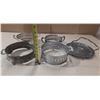 Image 2 : Vintage silver-plated casserole dish holders or trivets, often used to protect tables from hot dishe
