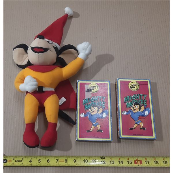 Vintage Mighty Mouse plush toy alongside two "Mighty Mouse and Friends" VHS tapes from the 24 Series