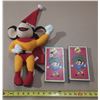 Image 1 : Vintage Mighty Mouse plush toy alongside two "Mighty Mouse and Friends" VHS tapes from the 24 Series