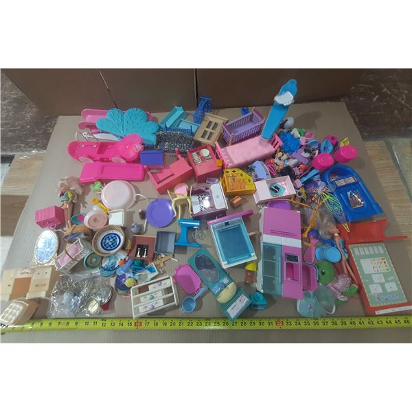 Large assortment of vintage and modern Barbie furniture and doll accessories.