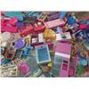 Image 6 : Large assortment of vintage and modern Barbie furniture and doll accessories.