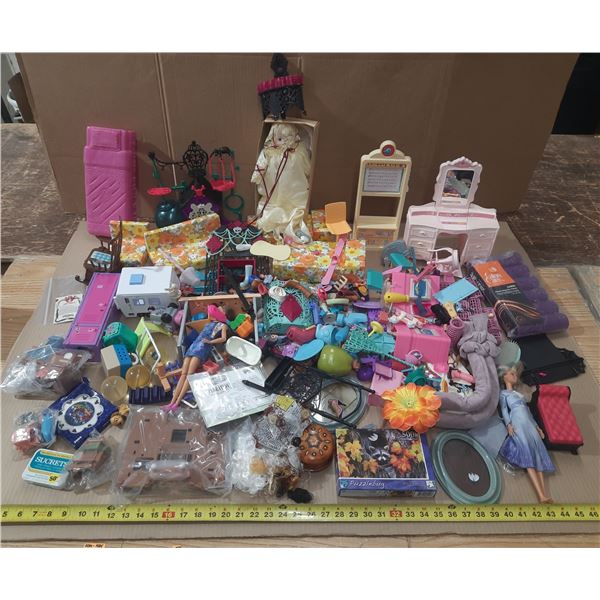 Lot of mixed Barbie toys, including dolls, furniture, and various accessories.