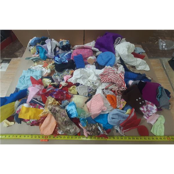 Large collection of vintage doll clothing and accessories, likely for Barbie dolls, featuring divers