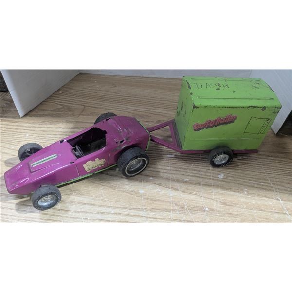 Vintage metal toy car with trailer