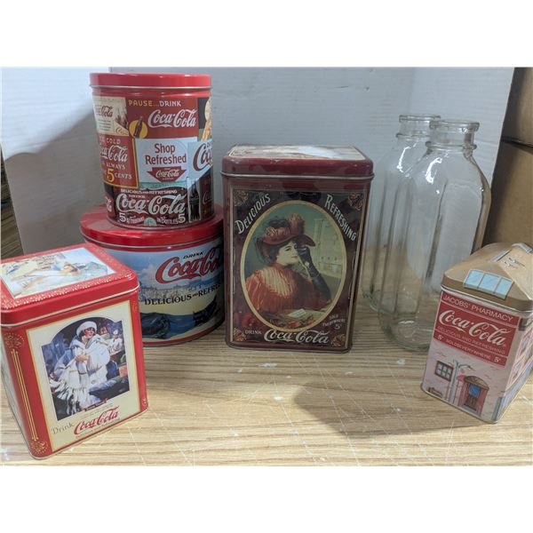 Vintage Coca-Cola tins with two glass milk bottles