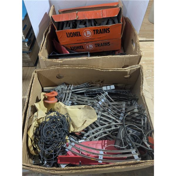 Box of tracks, train cars and accessories