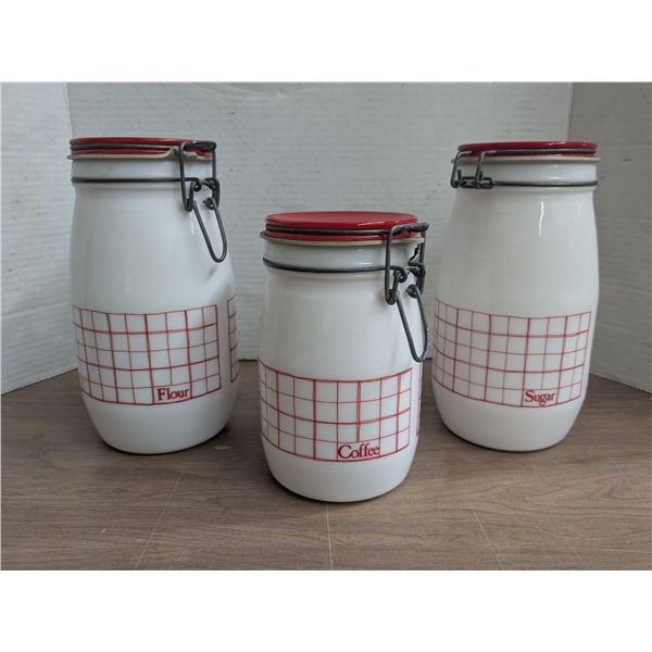 Set of 3 Glass storage jars, one marked "Wheaton Fine Glassware"