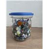 Image 1 : Plastic jar of marbles