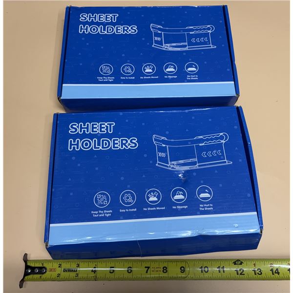 (2) Sheet holders with lock strips, designed to grip mattress corners and prevent fitted sheets from