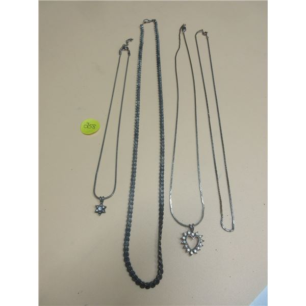 Lot of 4 silver chains- 2 with pendents- cannot verify authenticity