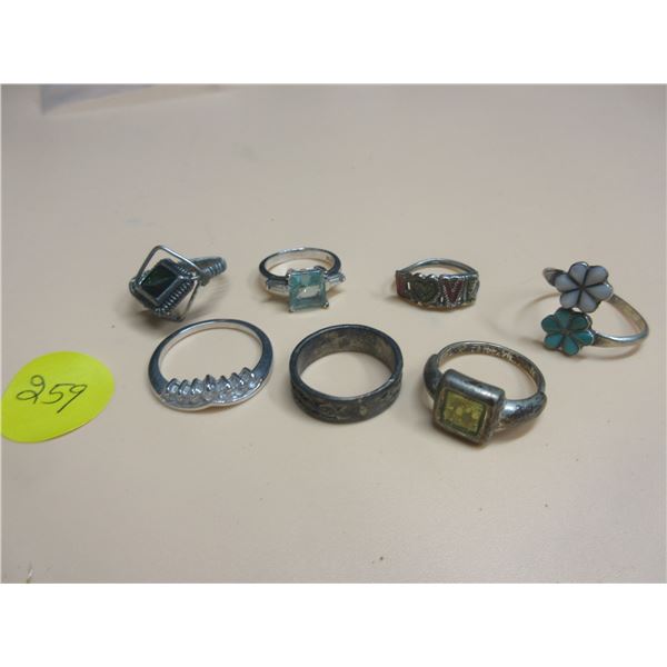 Lot of 7 rings of various sizes- looks silver -non magnetic