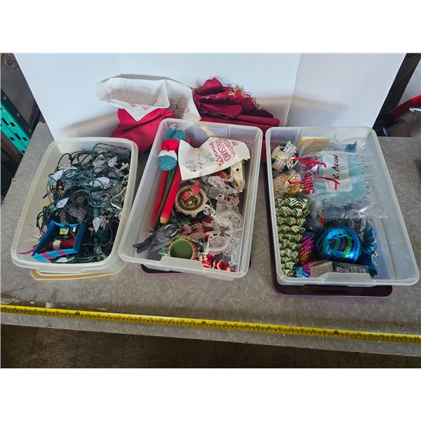 3 plastic containers full of christmas décor