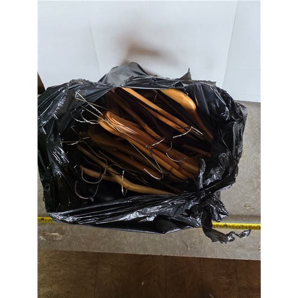 Bag full of wooden coat hangers