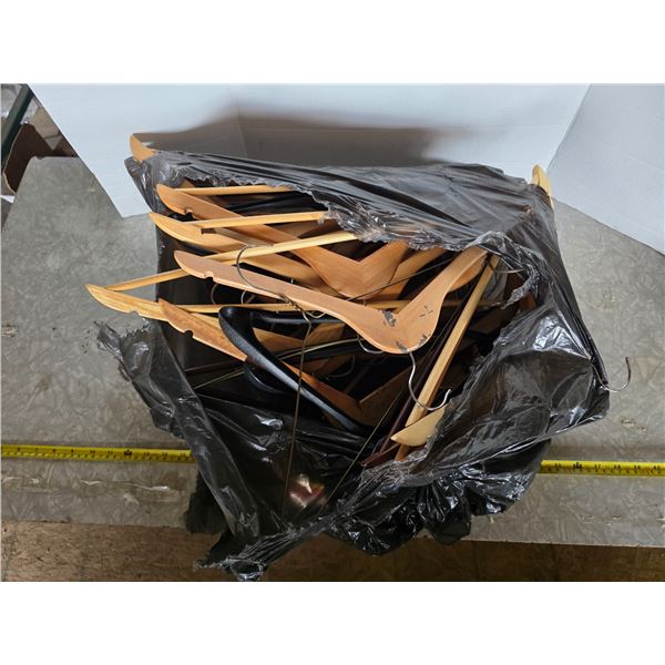 Bag full of wooden coat hangers