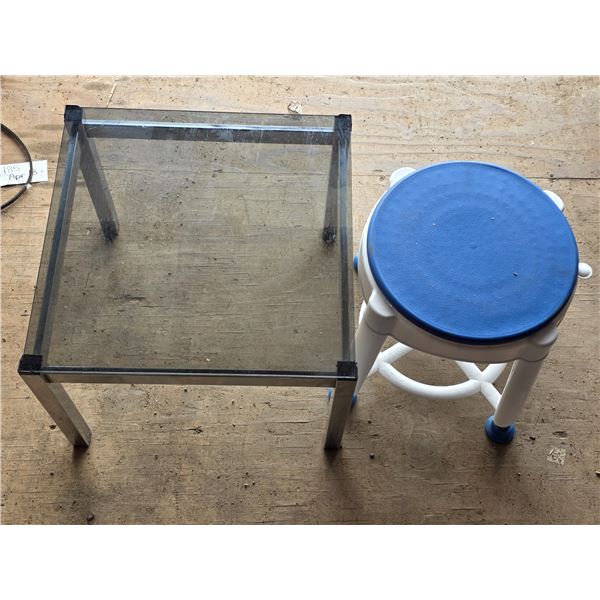 Small table with glass top and plastic stool