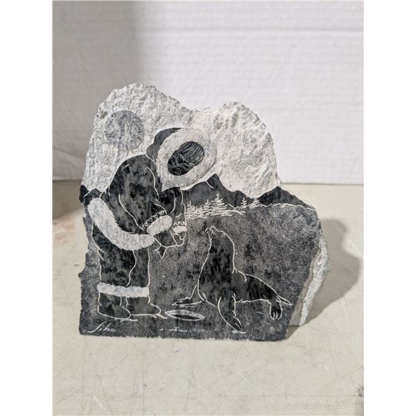 Soapstone etching, eskimo with seal
