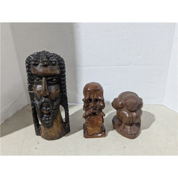 Carved wood décor, heads and weeping budha