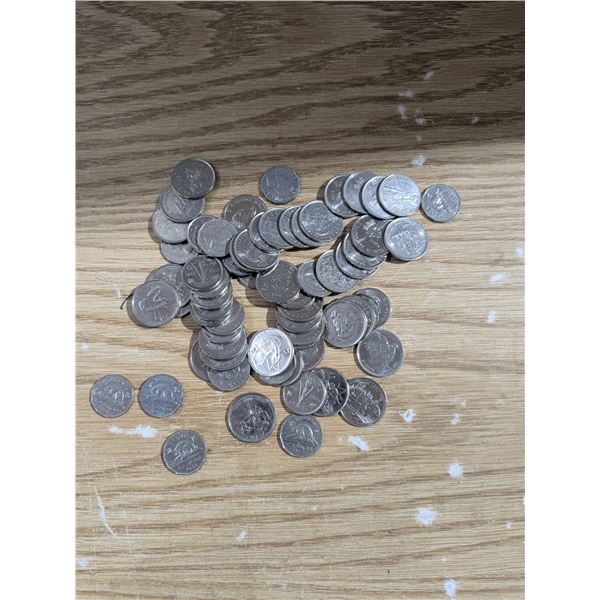 Approximately $10 canadian currency, commemorative quarters and older nickels