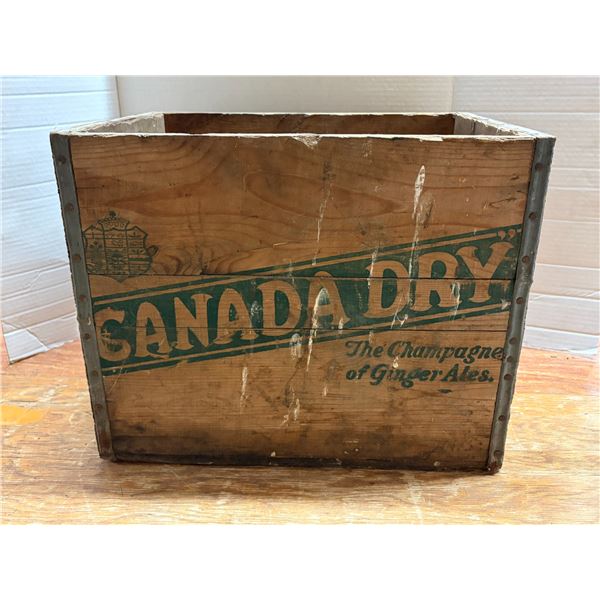 Vintage mid-20th-century Canada Dry wooden soda crate featuring the iconic green diagonal banner and