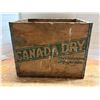 Image 1 : Vintage mid-20th-century Canada Dry wooden soda crate featuring the iconic green diagonal banner and