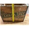 Image 2 : Vintage mid-20th-century Canada Dry wooden soda crate featuring the iconic green diagonal banner and