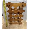 Image 1 : Vintage mid-century modern wooden stackable wine rack features a honey-toned finish and interlocking