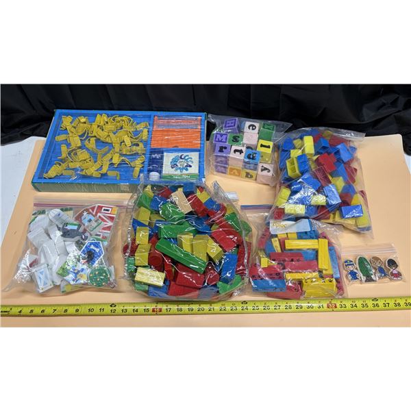 Collection of large building blocks and toddler toy sets, featuring colorful plastic bricks, wooden 