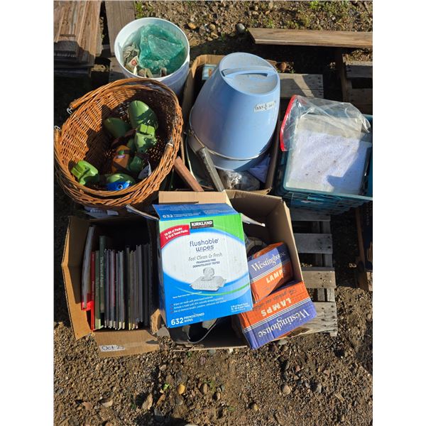 Pallet of misc items, books, toys, lamp bulbs, rackets
