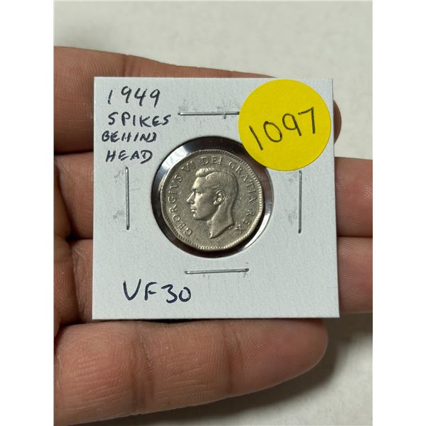 1949 Canadian 5 Cents. The Obverse has several Spikes behind the king’s head from a Die Cla