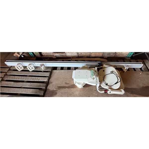 Straight stairlift system, with its motorized chair unit, padded seat, and an extruded aluminum modu